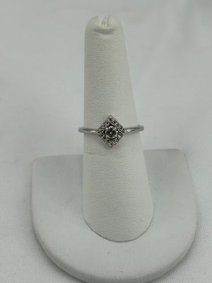 #1207009 14kt wg .17ct round center VS2 J color with .08ct square wavy halo