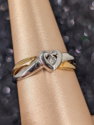 10k tt gold size 7 heart ring with dia center apx .07ct